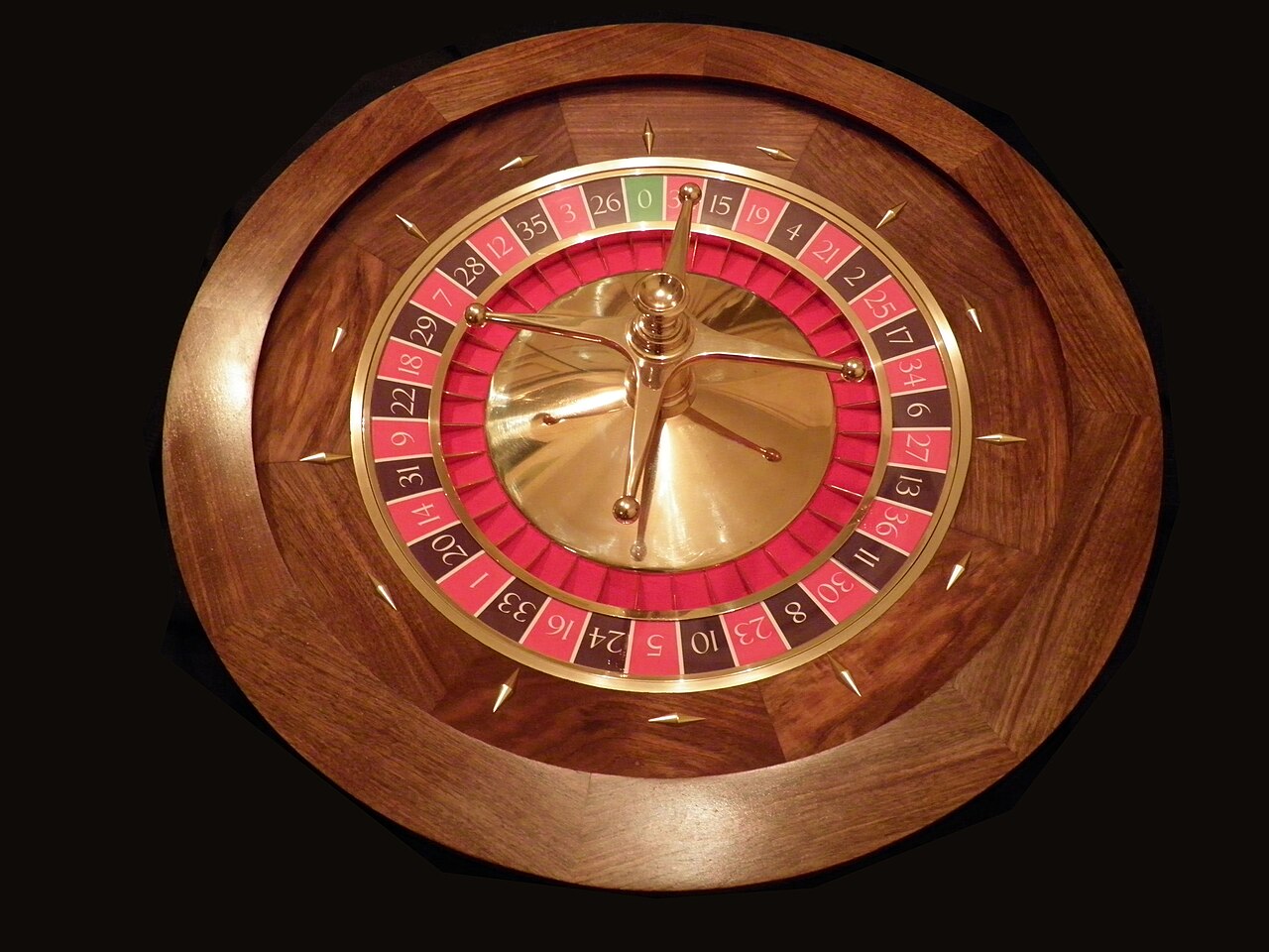 FairPlay Roulette Wheel: the ball running in the track of a spinning roulette wheel beside stacked chips